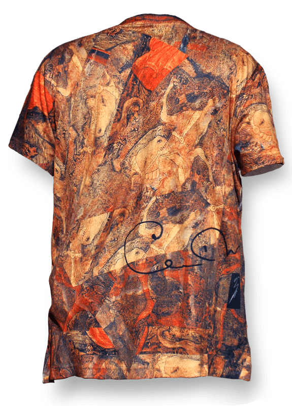 A man wearing an orange shirt with some brown and red designs