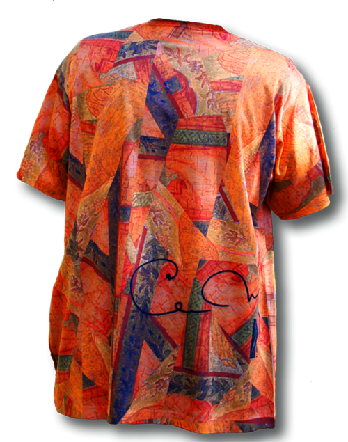 A person wearing an orange shirt with colorful designs.